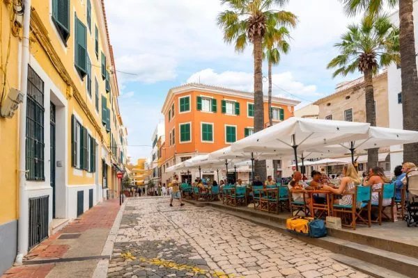 Charming old town architecture and palm trees in Mahon city center